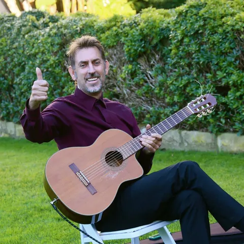 sam-adams-musician-san-ysidro-ranch-montecito Sam Adams playing guitar for a wedding at San Ysidro Ranch in Montecito, California